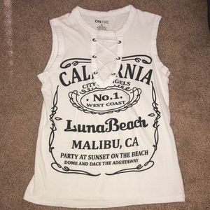 Low cut criss-cross tank top